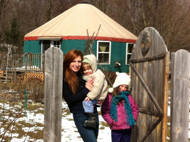 Michelle Mencher with children outside their yurt at Climbing Vine Cottage.