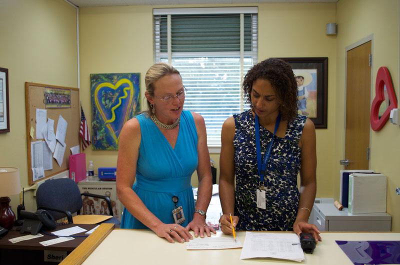 Samantha Little, principal of South Hill Elementary School, working with her secretary Jeannie Miller before the school day begins. 