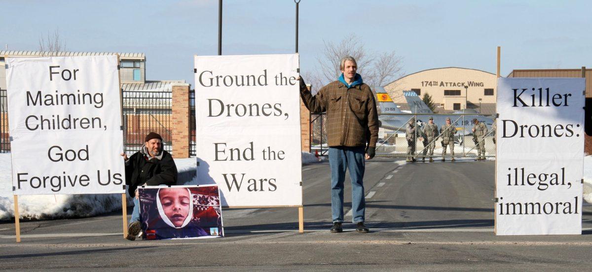 Members of the Upstate Drone Action organization stand outside of Hancock Field Air National Guard Base on Feb. 13, 2013 to protest drone strikes.