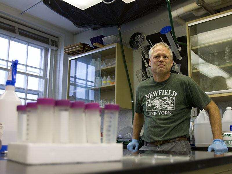 Michael Griggs, master's level research scientist at Cornell University, takes a break from his microbiological research to talk with a colleague.