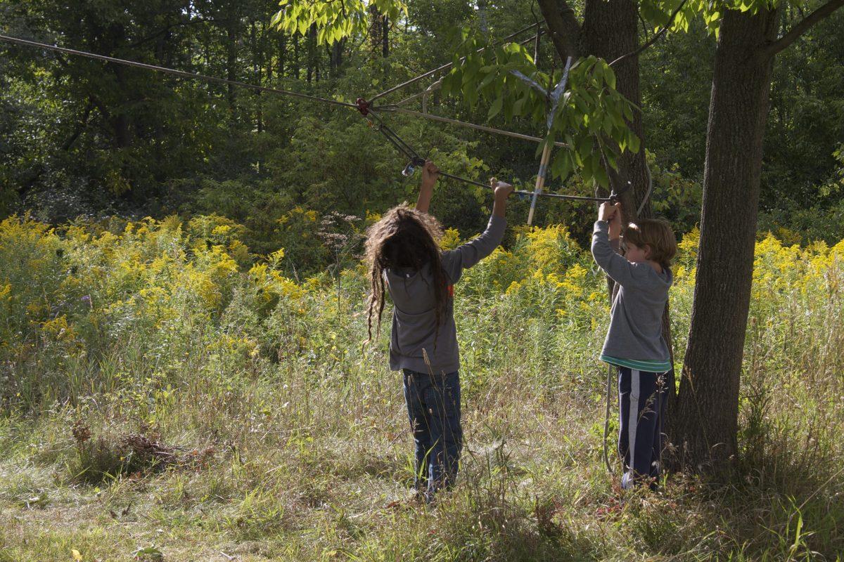 Students at 'Autumn Explorations' work together to construct a zipline. Alyvia Covert/Ithaca Week