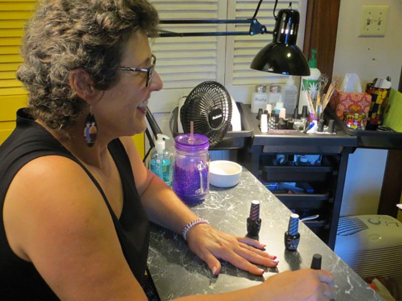 Nancy Gruen sits at her mobile nail station. She will be offering free trials for the rest of this month.