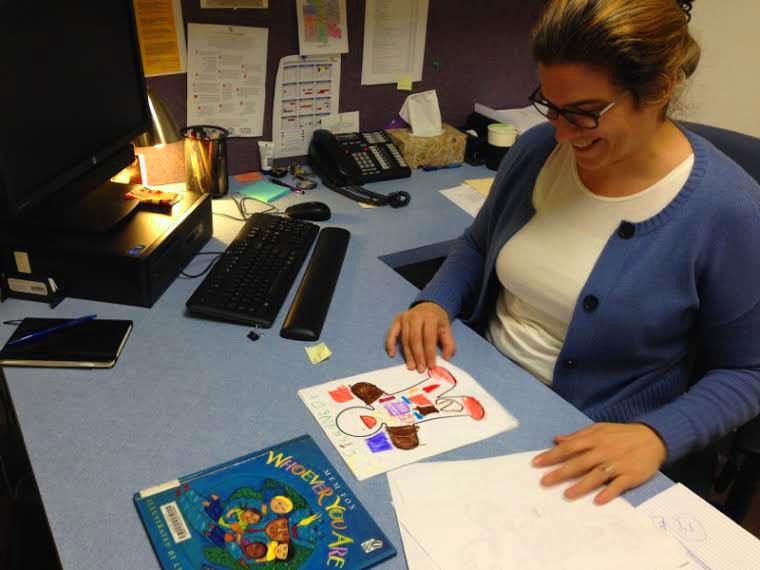 Sarah Simmons looks at artwork that students made from the first class.