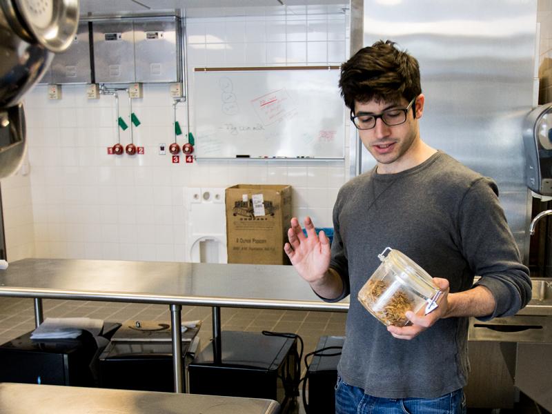 Lee Cadesky holds a jar of mealworms which he uses to make C-fu in the Stocking Hall kitchen