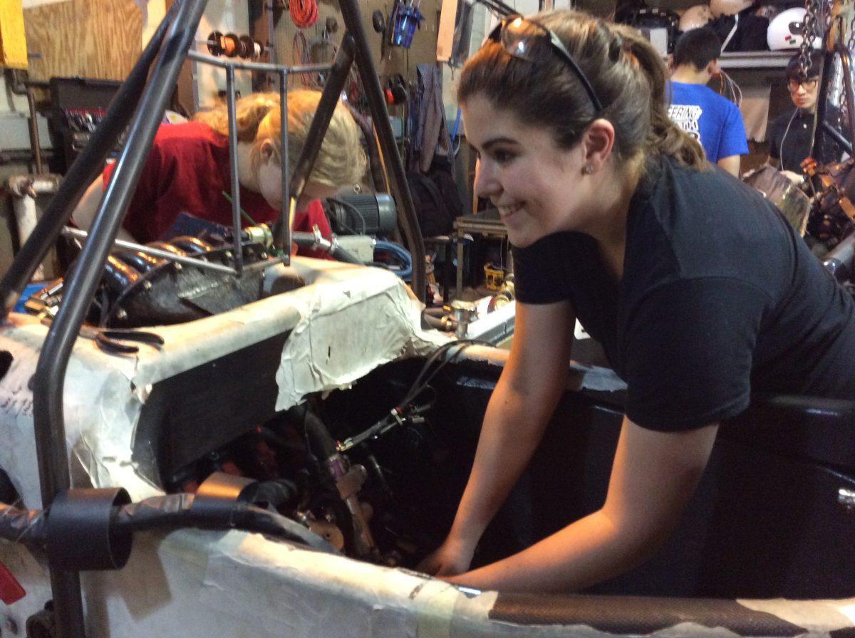 Cornell senior Nina Buchakjian works on the University racing team's Formula One SAE race car.