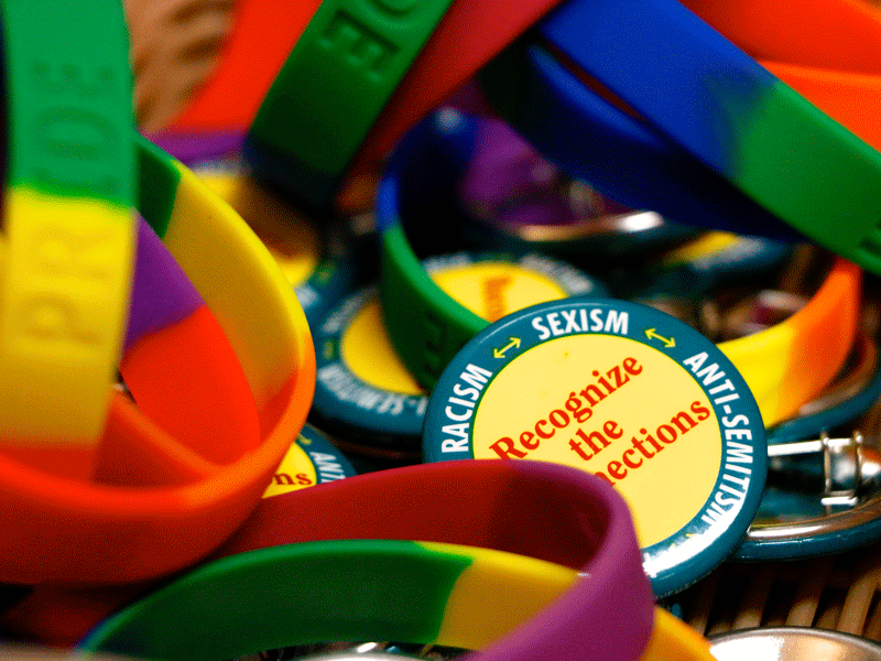Buttons and bracelets are kept in a basket at the LGBTQ Resource Center located on the Cornell University campus. 