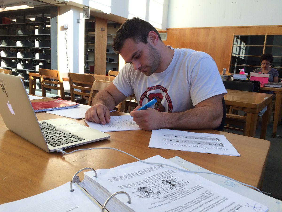 Dan Cimino, a second year graduate student featured on “Vet School,” studies in a Cornell library. © Ithaca Week 2015 / Emily Masters and Frances Johnson