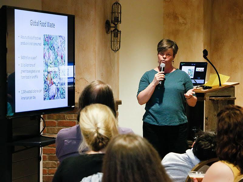 Cornell University Associate Professor Kathie Hodge presents about mold and fungi found in food for a Science Cabaret gathering Sept. 15.