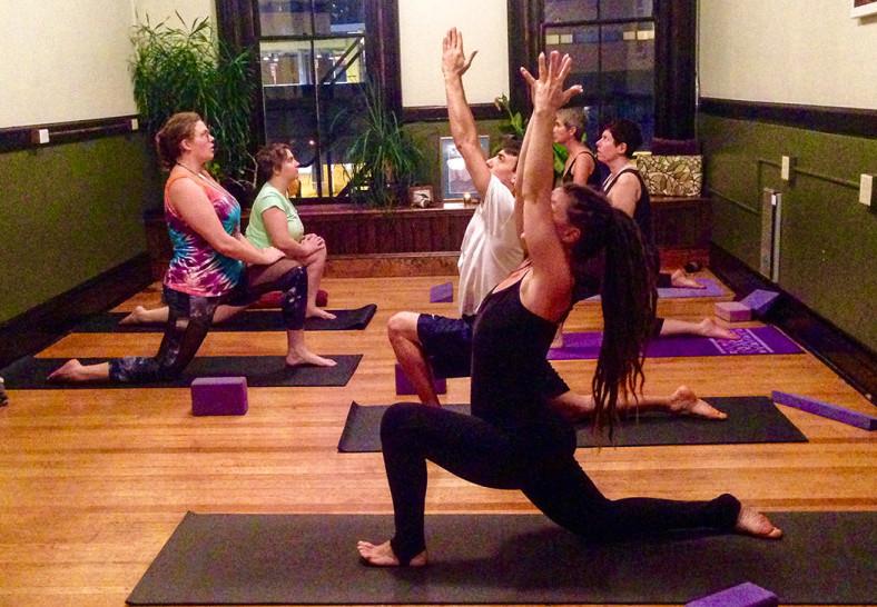 Yoga+School+Director+Lennessa+Shantaya+teaches+the+class+a+pose.