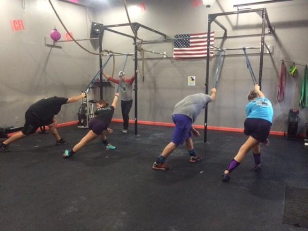 Jared Jordan, co-owner and head coach at CrossFit of Ithaca, teaches a CrossFit class.