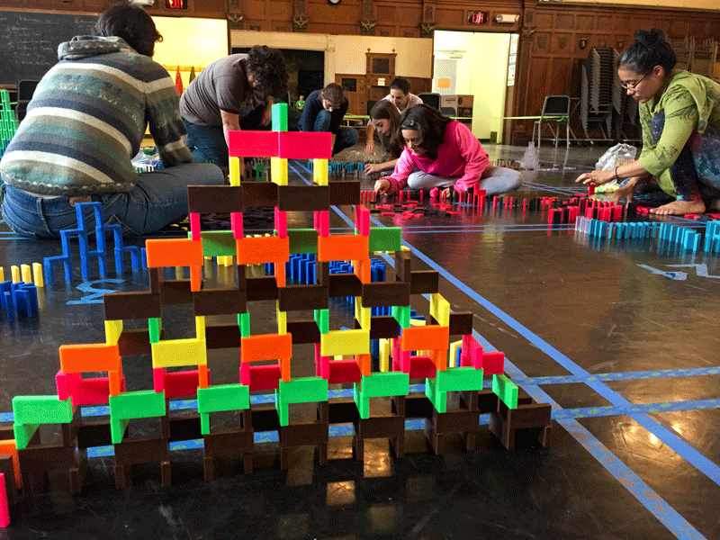 Participants in the Ithaca Domino Project work on their structures. This event is one of the many featured in the 8th Annual Arts for All Marathon through the CSMA. ©Ithaca Week/Kelli Kyle.