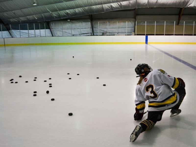 Ithaca Sirens player Sarah Reinholt warms up before practice begins. 