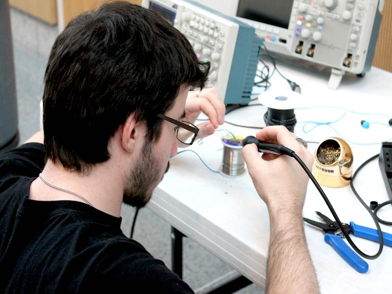 A student puts his hands to work creating his prototype at the Life Changing Labs’ Make-a-thon Feb. 21. 