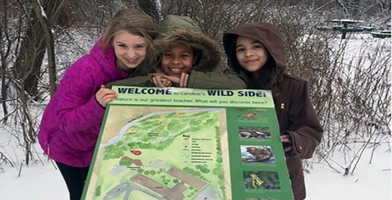 From left, Ilana Lehmann, Samara Clare, and Makayla McEver are three fifth-graders in Danielle Rottenstein’s class who helped certify the wilderness campus as a wildlife habitat.