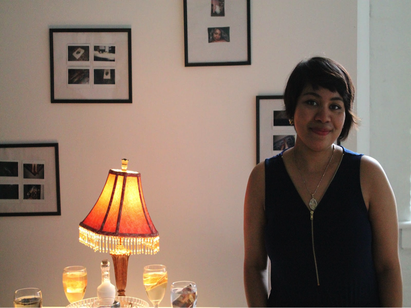 Laureen Andalib stands in front of one of her works featured in The Intrinsic Code of Language exhibit.