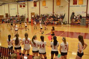 With only six players on the court, the others stand by watching and cheering for their team. / Photo by Cecilia Morales