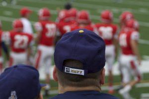 A navy fan looks on during the second quarter as Navy leads Cornell 28–7.