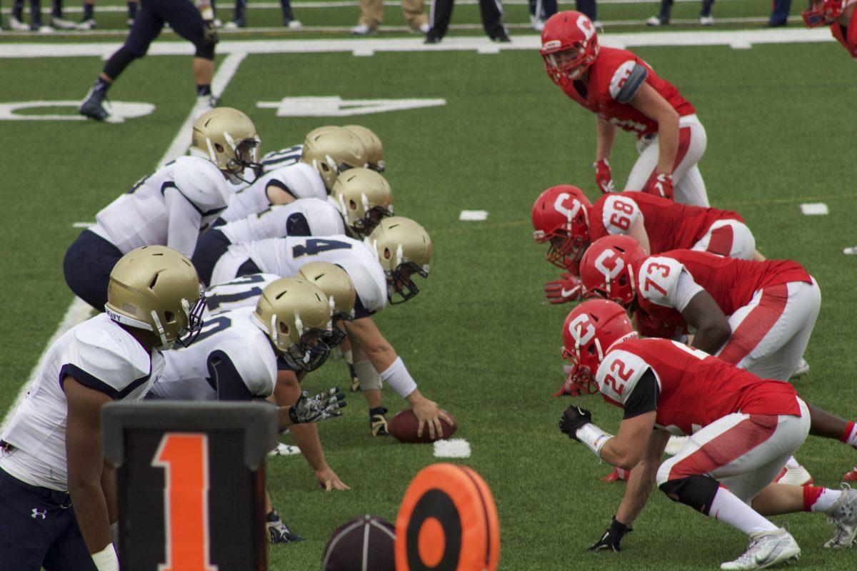 The Navy offensive line and the Cornell defense square off around the 40 yard line during the second quarter. Photo by Rachel Wolfgang