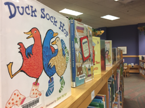 Books lay atop shelves in the library