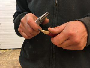 Photo by Sydney O’Shaughnessy Owner and founder of Hammerstone School Maria Klemperer Johnson teaches her students how to sharpen a carpentry pencil. This is one of the first lessons she introduces to her classes.