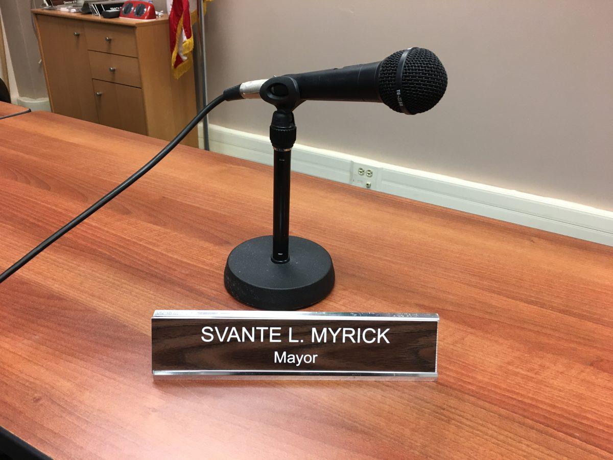 Mayor of the City of Ithaca, Svante Myricks name placard with his microphone.