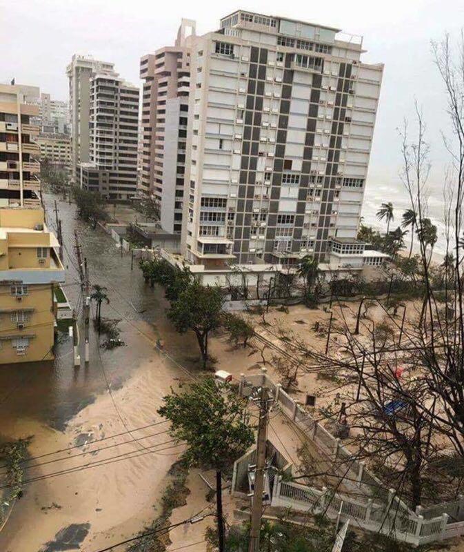 San Juan apartment view of street covered in sand and debris. Photo courtesy of Andre Rojas.