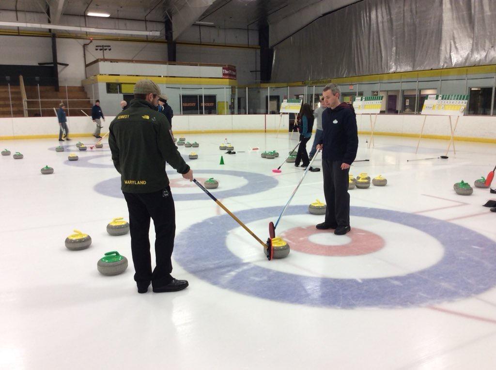 Photo of two curlers strategizing