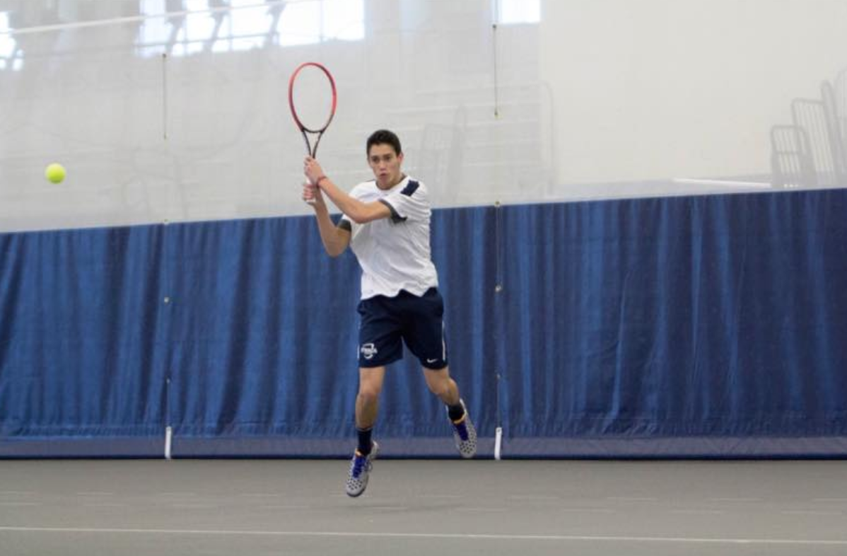 Michael Gardiner playing tennis for Ithaca College during his Sophomore year. 