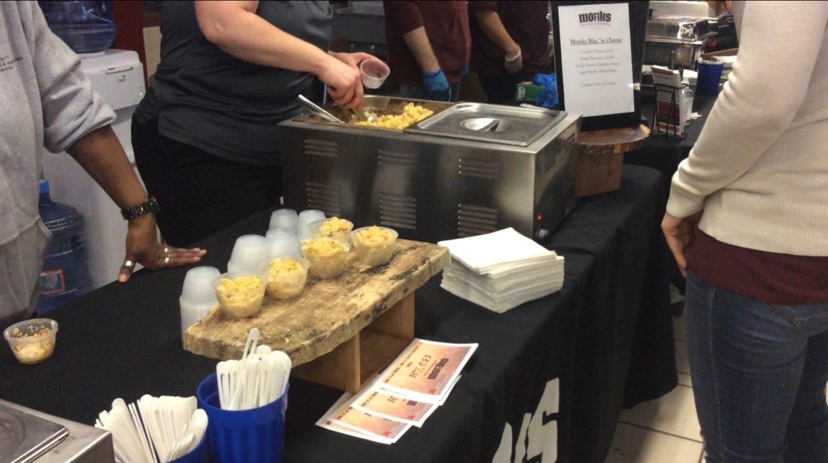Mac and cheese is scooped and served by Monks on the Commons. Photo by Rae Harris/Ithaca Week