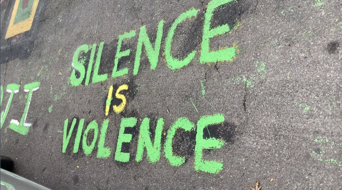 Silence is Violence was written alongside the Black Lives Matter mural painted at the intersection of Plain St. and MLK Jr. St. in Ithaca, NY. This mural was created over the summer by local BLM organizers with support from Ithaca Mayor Svante Myrick. (Ithaca Week/Madison Moore).