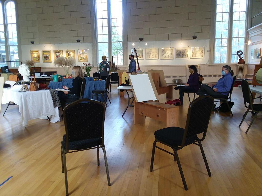 Photo of people drawing at still lifes