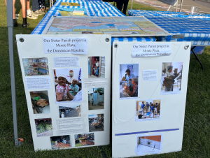 A display at the Ithaca Peace Festival to educate the attendees on St. Catherine of Siena Church's sister chapter Portal de Belén School in the Dominican Republic that they donate proceeds to each year. | Source: Lucy Calderon