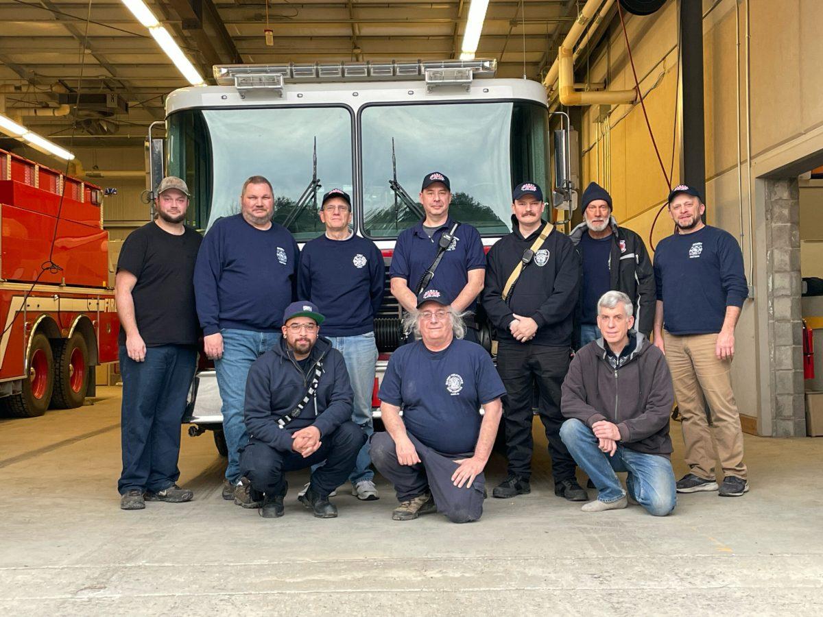 Members of the Danby Volunteer Fire Company standing front of one of the fire trucks. (Photo by Jadyn Davis/Ithaca Week) 