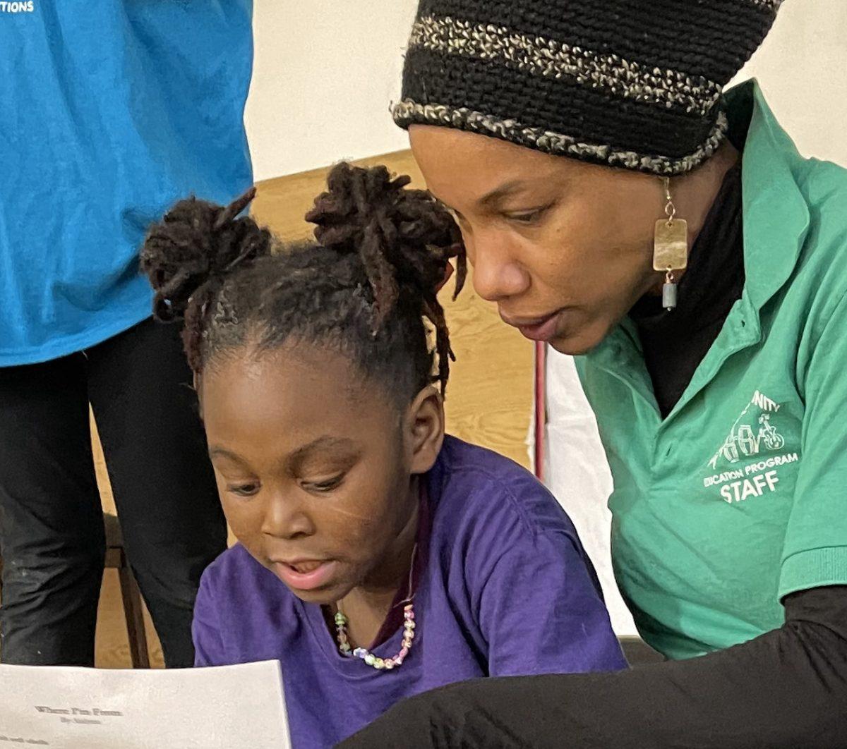 Dr. Nia Nunn works with student. (Photo by: Devan Adegbile)