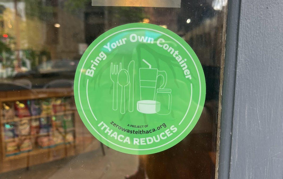 Zero Waste Ithacas BYO sticker displayed on a window (photo by Maddy Vogel/Ithaca Week)