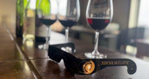 Solar eclipse glasses are displayed alongside wine glasses/Photo by Gabriella Baiano for Ithaca Week