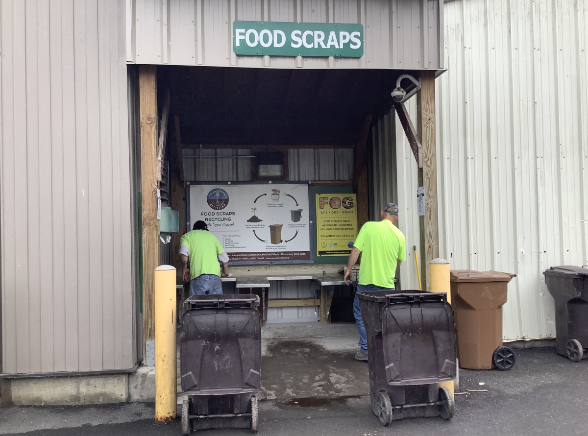 Employees collecting from the drop-off site at The Recycling and Solid Waste Center. (Rachel Williams/Ithaca Week)