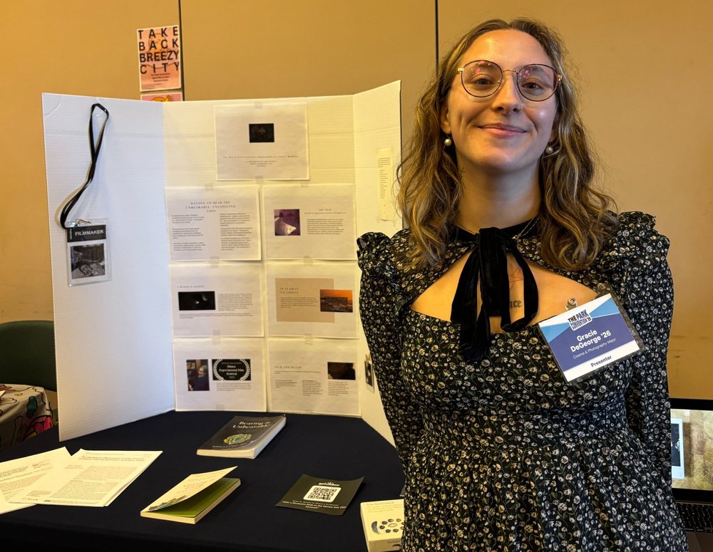 Grace DeGeorge with her booth at the 2025 Park Convention. (Samantha Ruiz/Ithaca Week)