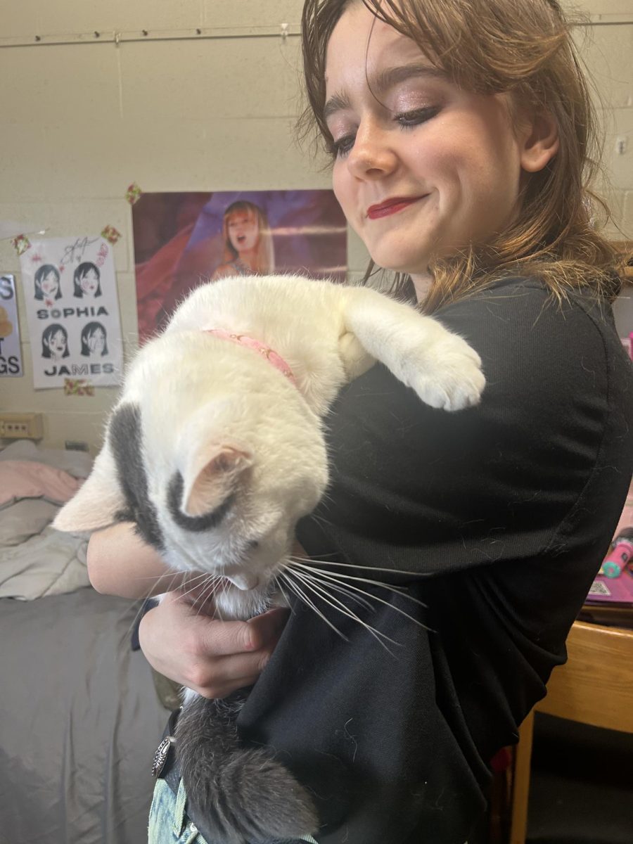 Ithaca College freshman Alise Polselli with her service animal, Susie. 