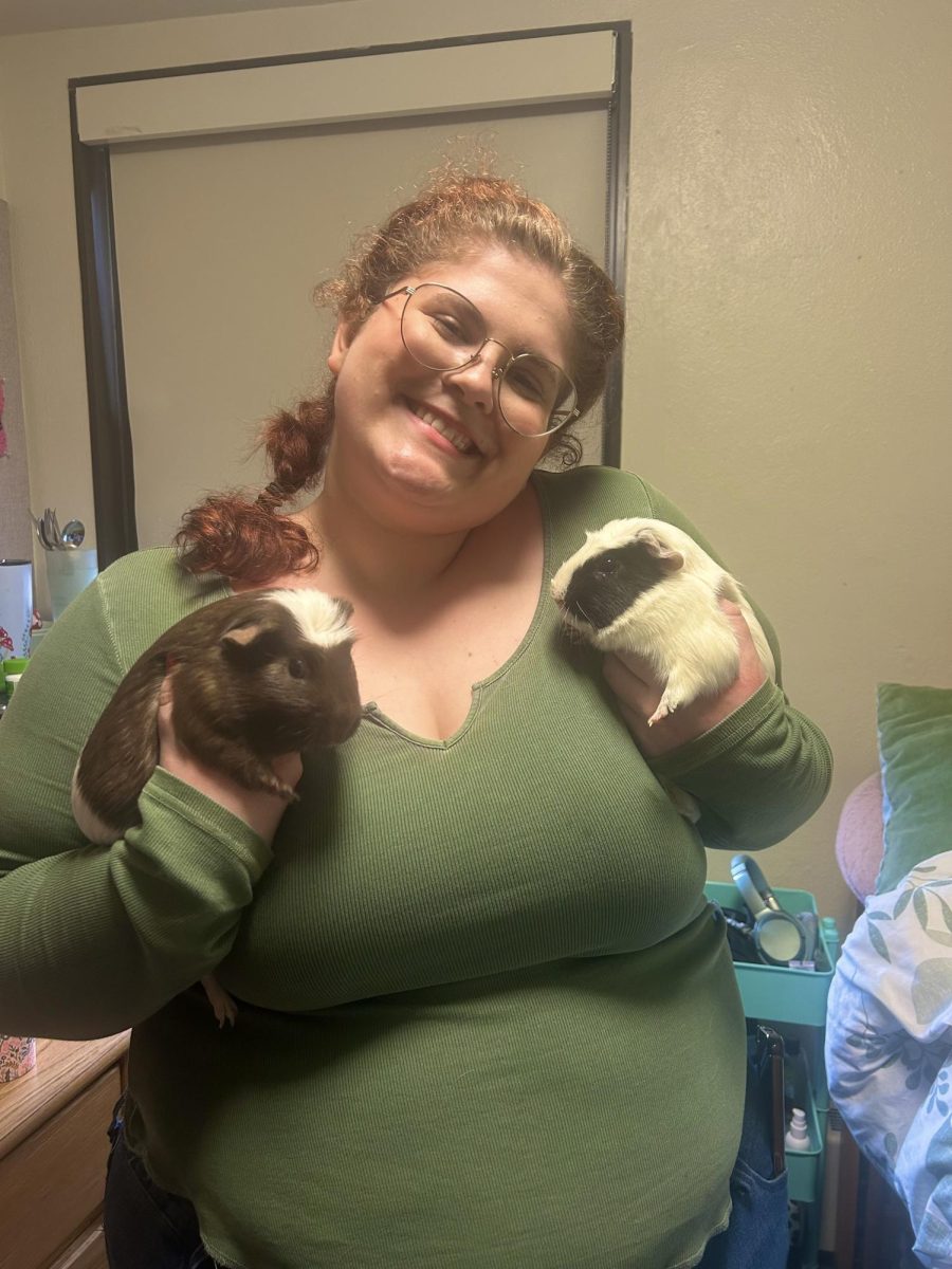 Ithaca College freshman Megan Rissolo with her Emotional Support guinea pigs, Cookie and Cream. 