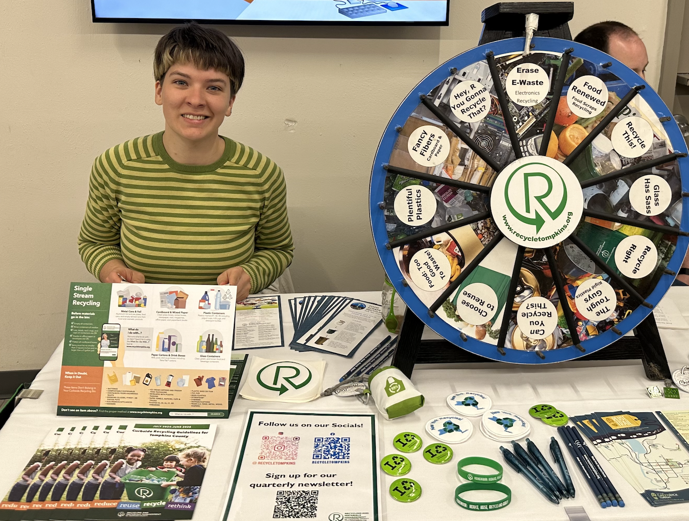 Wren Kingsley at the Tompkins County Department of Waste and Materials Management booth during Sustainability Week 
