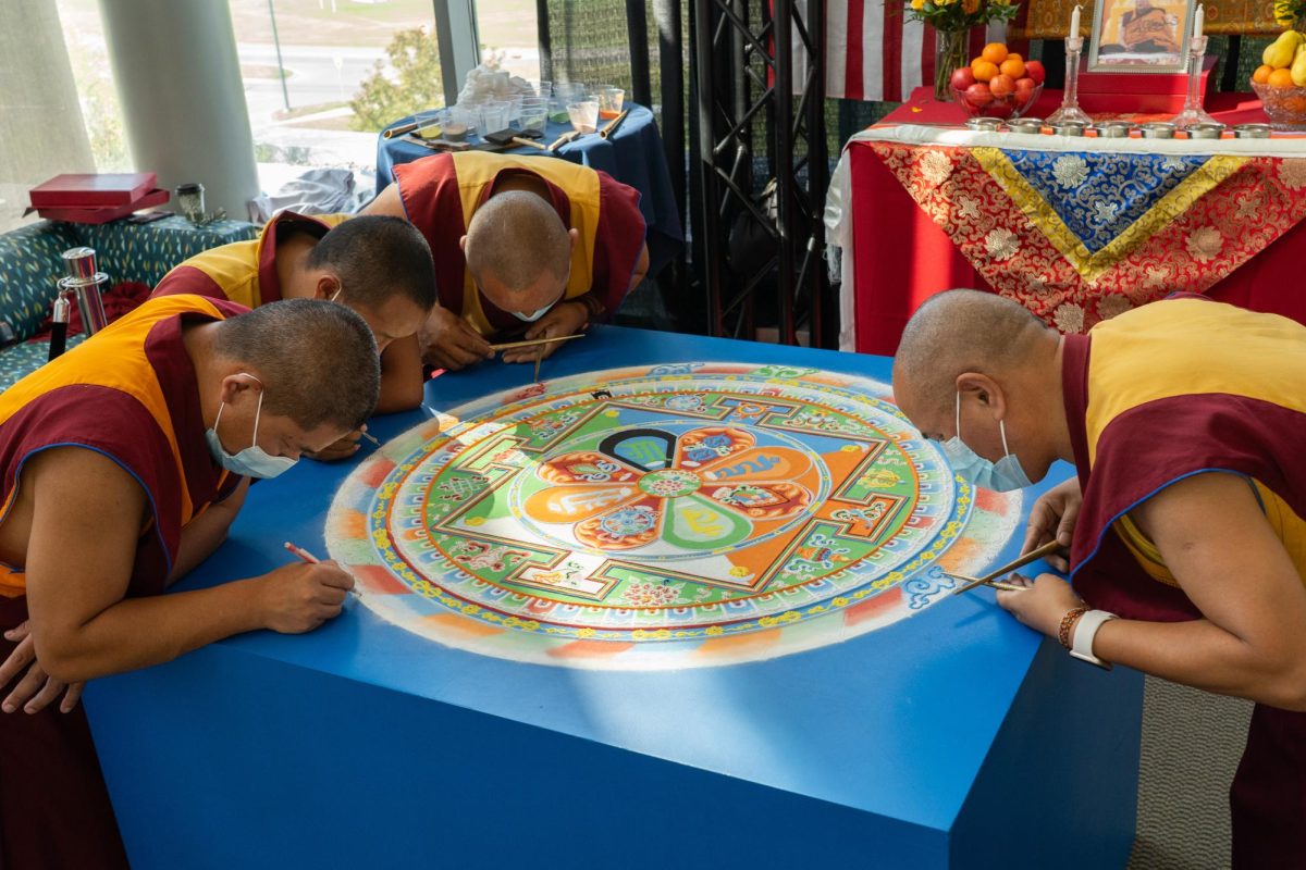 The mandala is near completion. From left to right: Kalsang, Norbu, Jigme, Gyatso. Ithaca. September 2025. 
