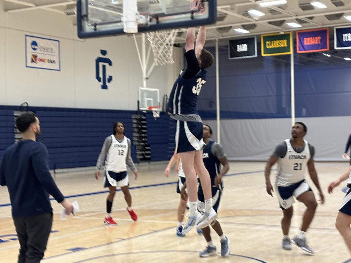 Junior center David Luberoff rises up in a practice scrimmage. Luberoff is one of two transfers on the Ithaca roster.