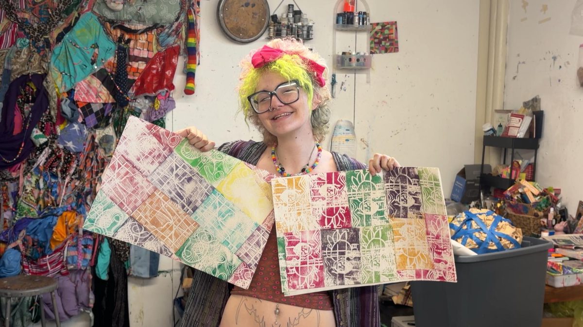 IC student and Ink Shop featured artist Vic Woods shows off some of their prints.