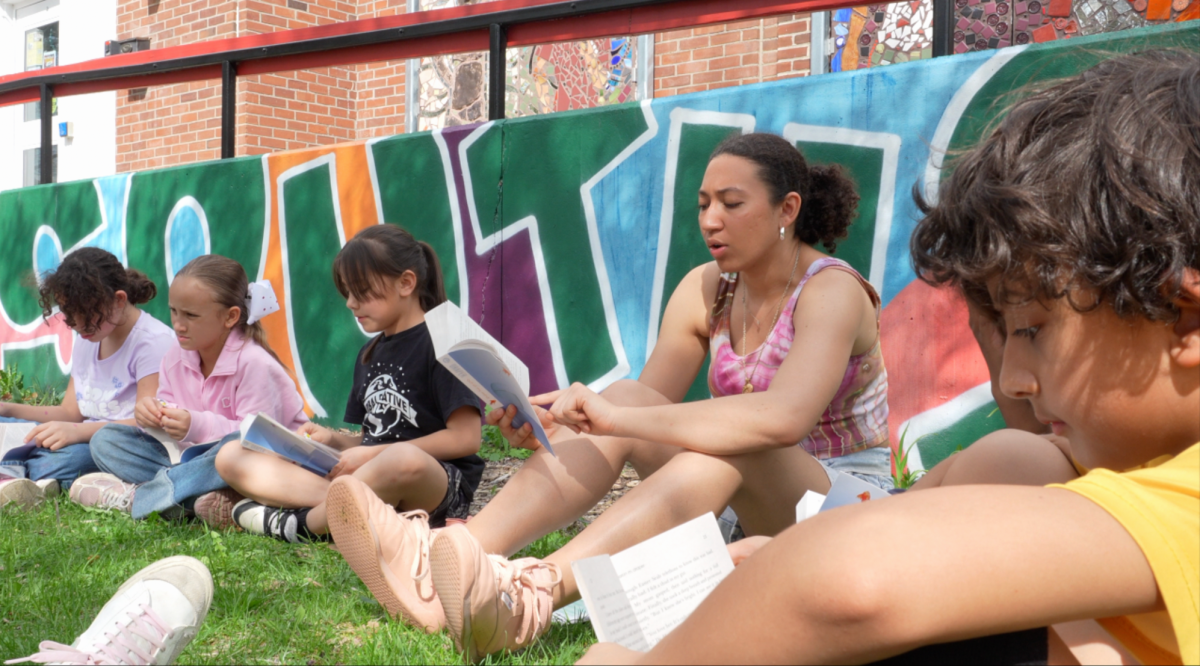 Ithaca College students like Ruby Gracianette join fourth and fifth graders to read "Out of My Mind" during the CUMEP Spring Book Club, one of the events included in the 2026 Community Read for Educational Freedom.