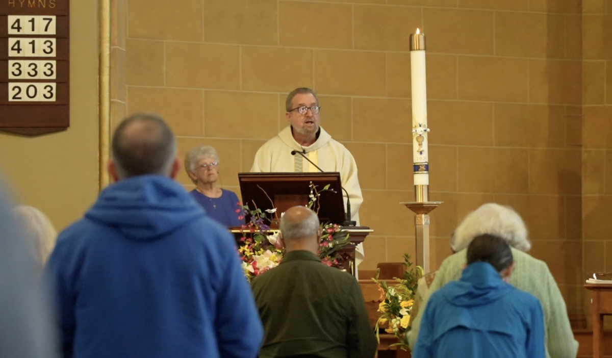 Fr. Brendan Buckley celebrates Mass at Immaculate Conception church: Christian Gratto / Ithaca Week